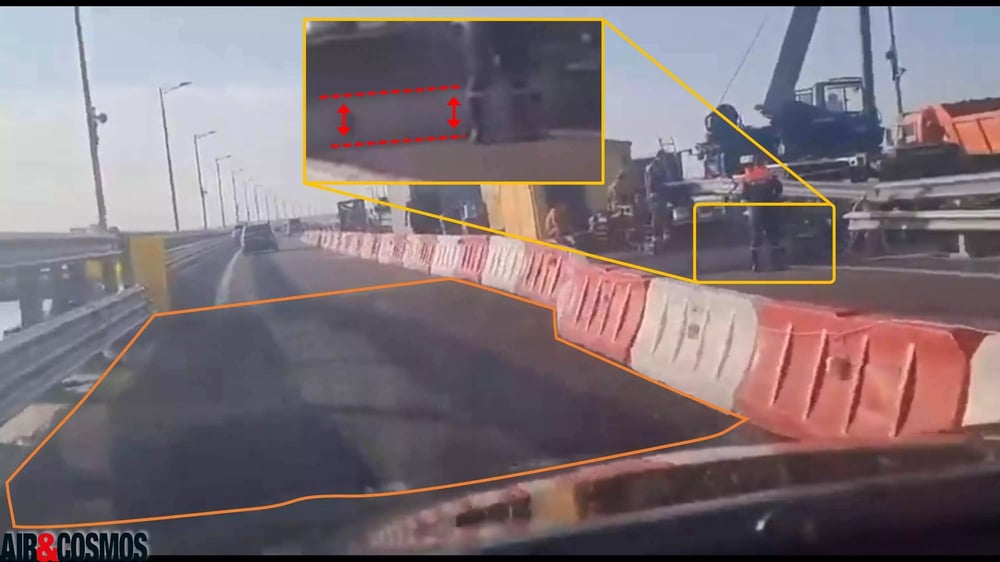 La fameuse bande de circulation réouverte : de l'asphalte (en orange) permet de combler la différence de hauteur entre les deux pans routiers. Cette différence est estimée à ~30 cm (en rouge).