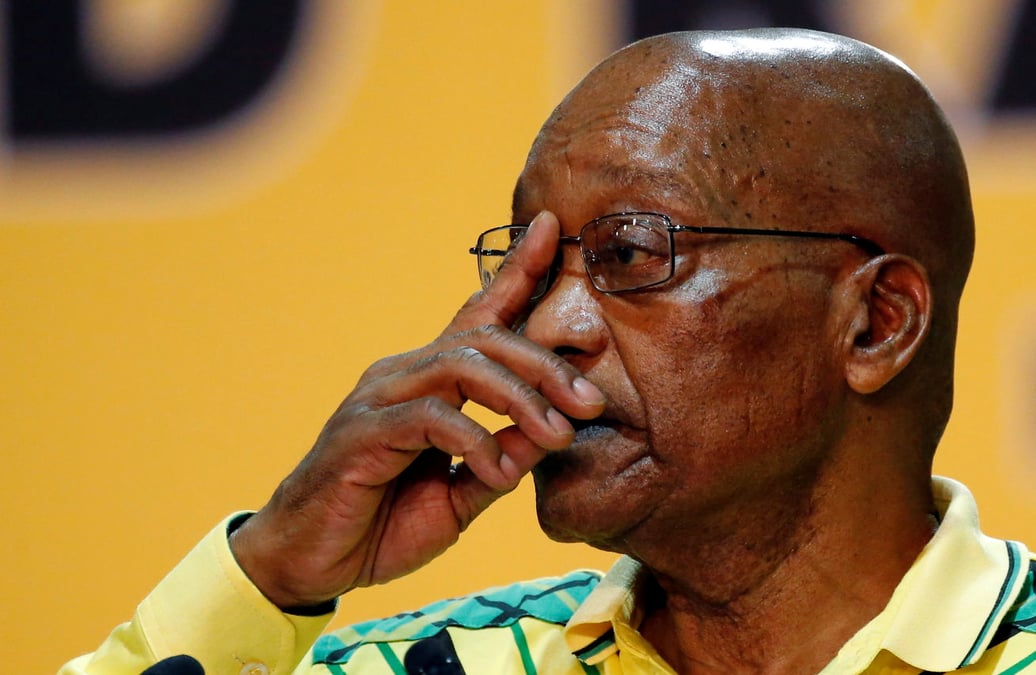 President of south africa jacob zuma gestures to his supporters at the 54th national conference of the ruling anc at the nasrec expo centre in johannesburg