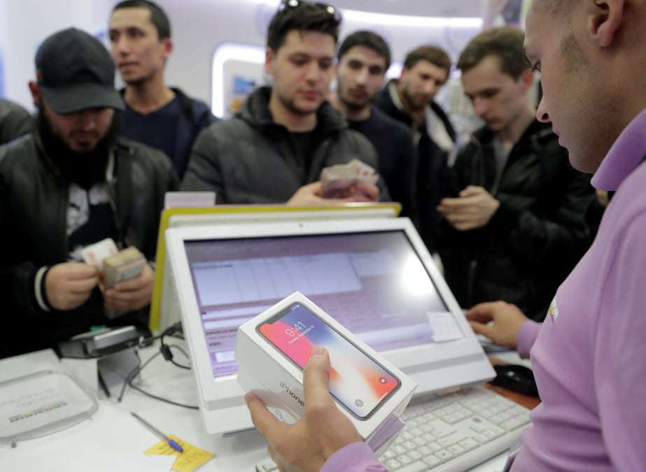 Apple franchit les 1.000 milliards de dollars de capitalisation boursiere