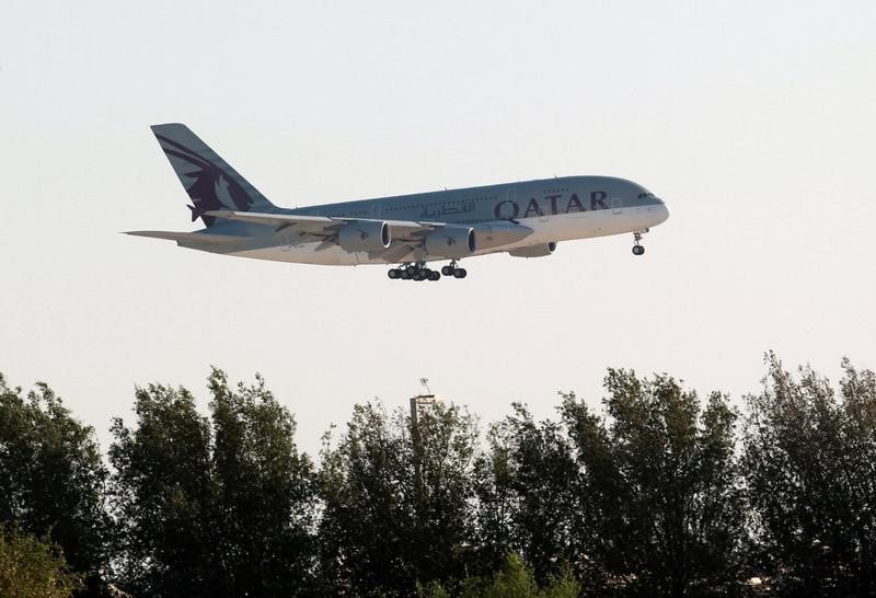 Qatar airways plane is seen over doha