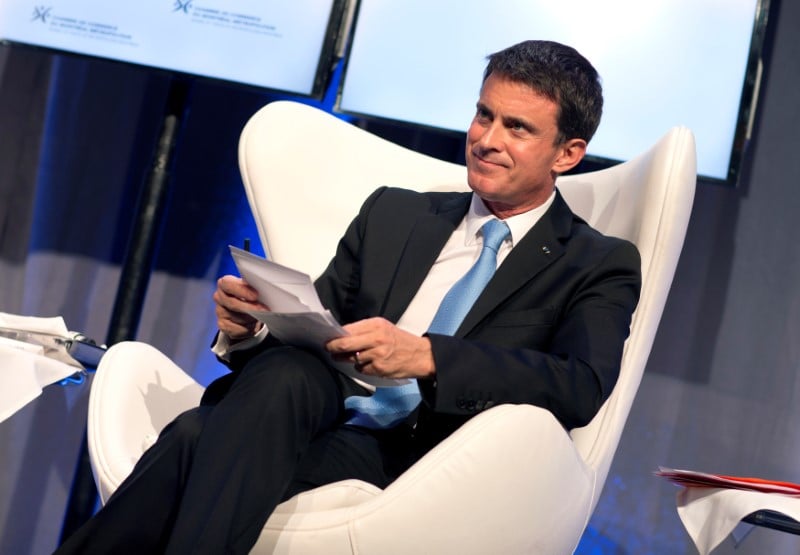France's pm valls looks over his notes during a luncheon for the montreal board of trade in montreal