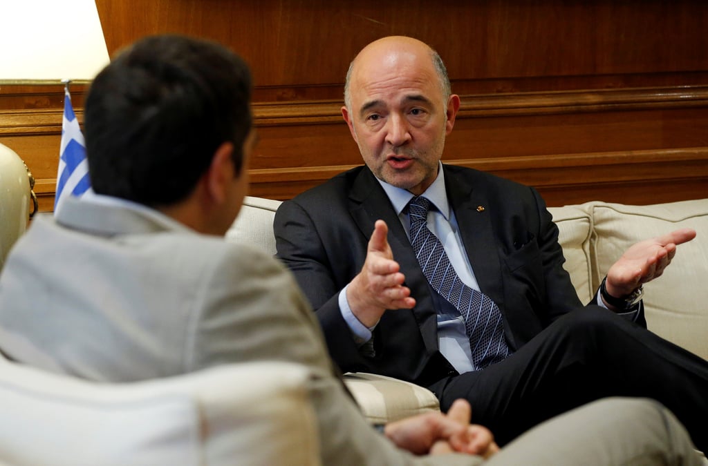 Grece: moscovici salue la sortie du plan de renflouement