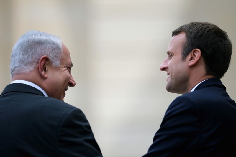 French president emmanuel macron escorts israeli prime minister benjamin netanyahu after their meeting at the elysee palace in paris