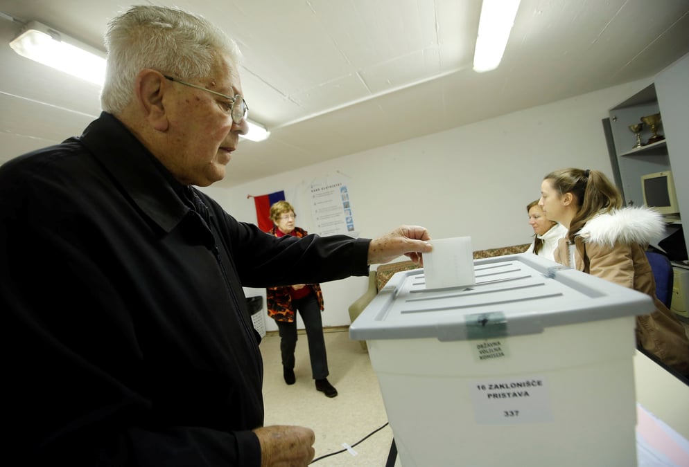 A man casts his ballot at a polling station during the second round of the presidential election in nova gorica