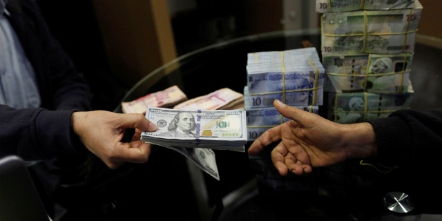 dollar dinar change Libye