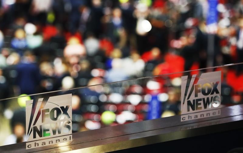 The logos of fox news channel are seen engraved on the glass of one of their booths at the republican national convention in cleveland