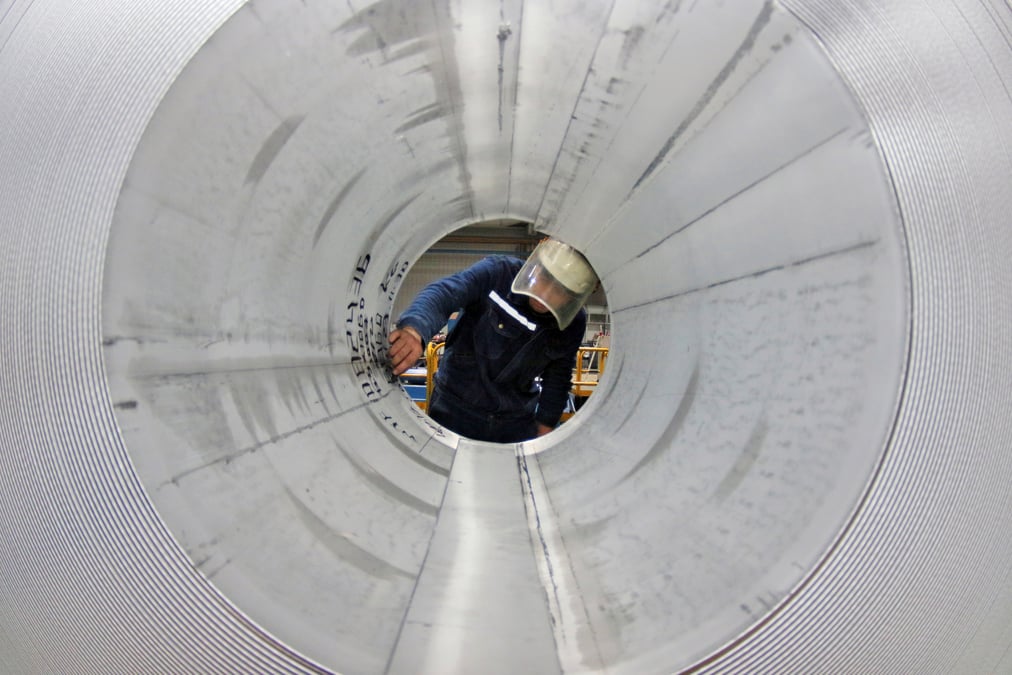 Employee works at the production line of aluminium rolls at a factory in zouping