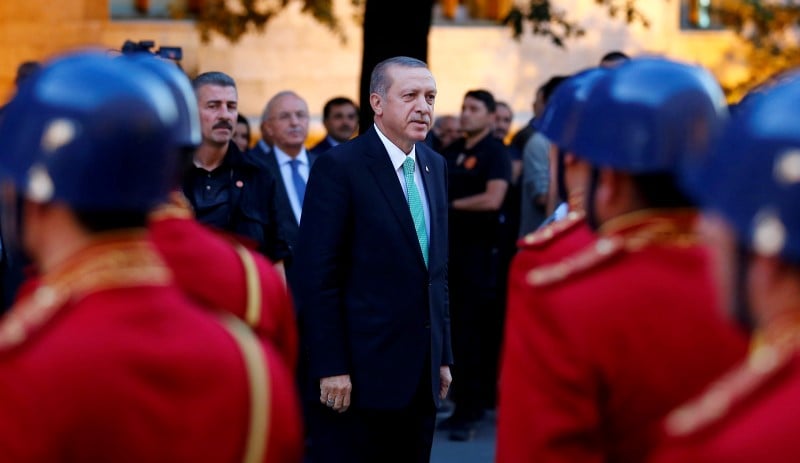 Turkish president tayyip erdogan reviews a guard of honour as he arrives to the turkish parliament in ankara