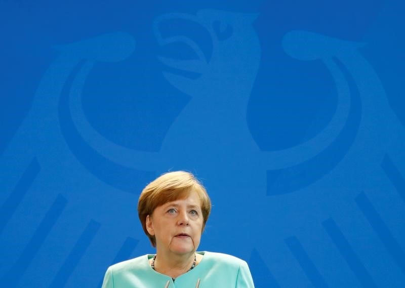 Merkel defend l'accord de paris, au nom de "notre mere la terre"