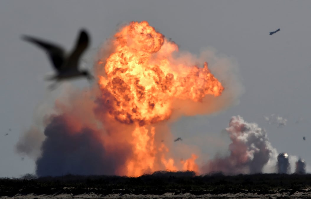 The spacex starship sn9 explodes into a fireball after its high altitude test flight from test facilities in boca chica