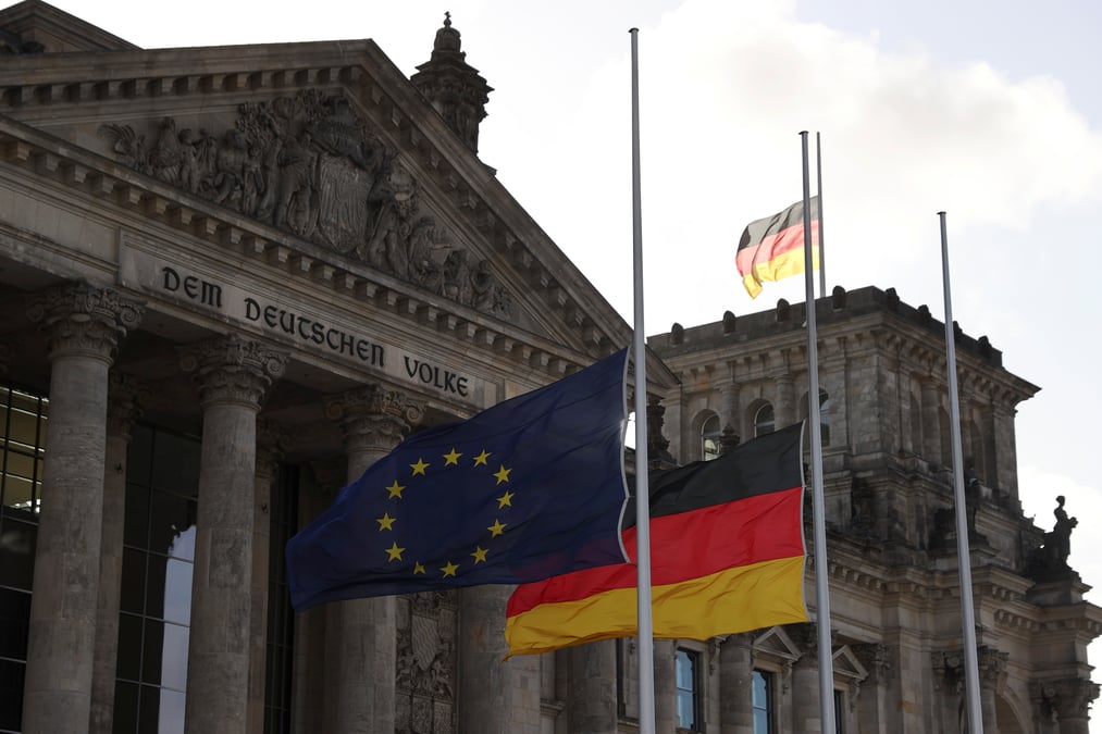 Eu and german flags fly at half-mast for the victims of a shooting in hanau, in berlin