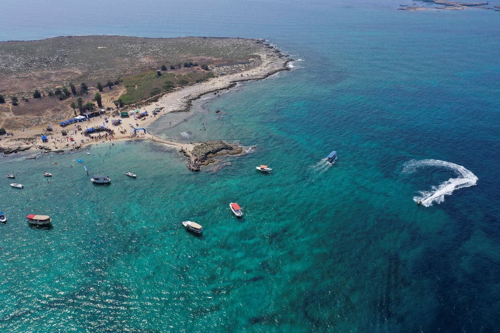 People enjoy the sea at the palm islands nature reserve in lebanon