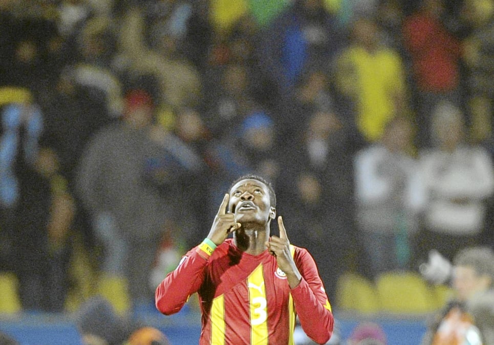 Ghana's striker Asamoah Gyan celebrates after scoring in extra time during the 2010 World Cup round of 16 football match USA vs. Ghana on June 26, 2010 at Royal Bafokeng stadium in Rustenburg. NO PUSH TO MOBILE / MOBILE USE SOLELY WITHIN EDITORIAL ARTICLE -    AFP PHOTO / GIANLUIGI GUERCIA