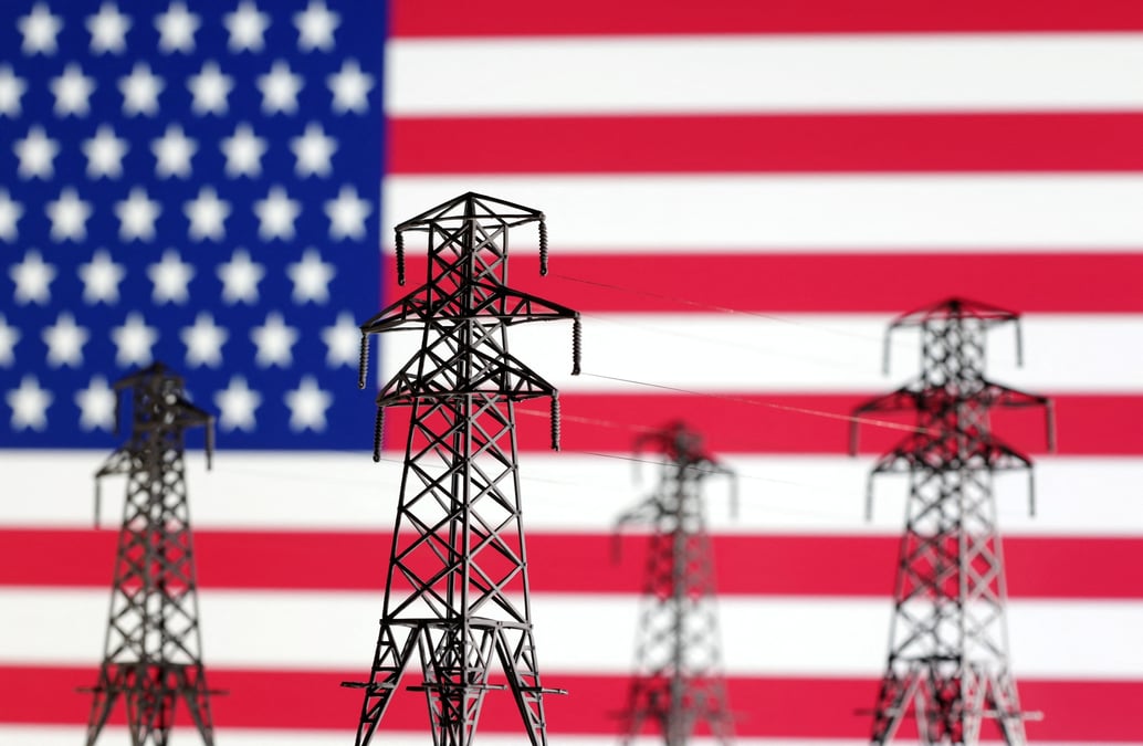 L'illustration montre des miniatures de transmission d'energie electrique et le drapeau americain