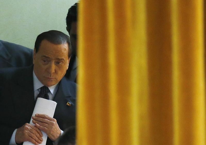 Forza italia leader berlusconi arrives for a party rally in milan