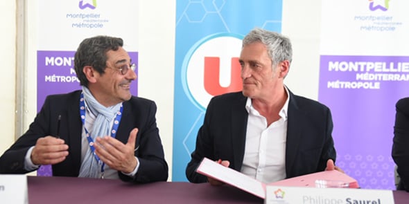 Serge Papin, P-dg du groupement Système U, et Philippe Saurel, président de la Métropole de Montpellier, ont signé une convention de partenariat le 2 mai 2018.