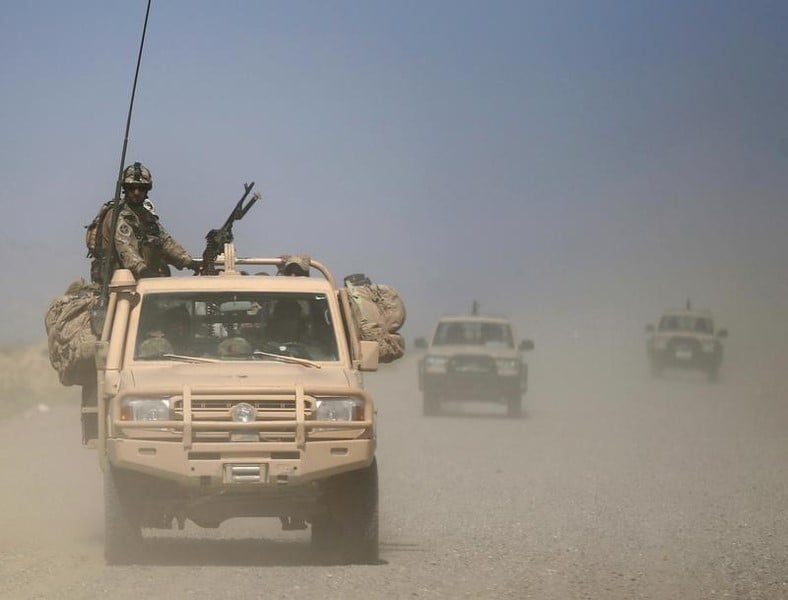 Afghan security forces patrol at the kunduz