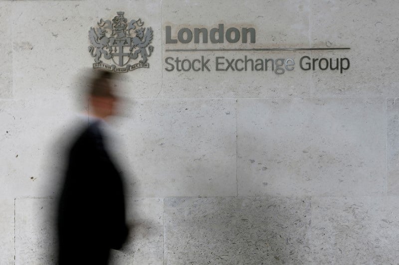 File photo: file photo: a man walks past the london stock exchange in the city of london