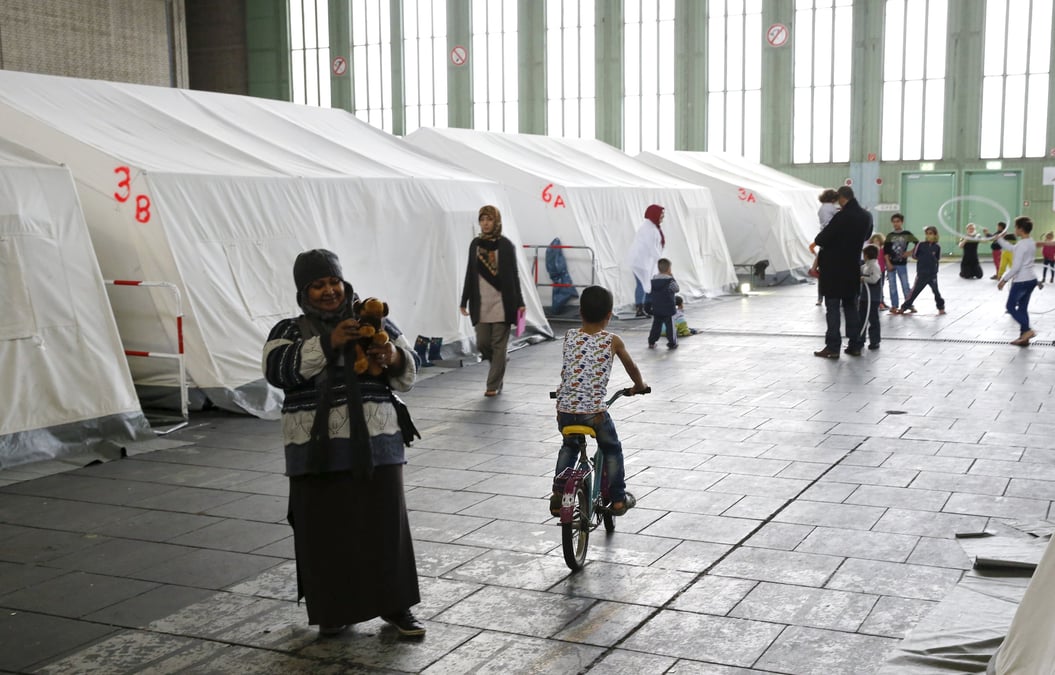 Merkel veut "drastiquement reduire" l'arrivee de refugies