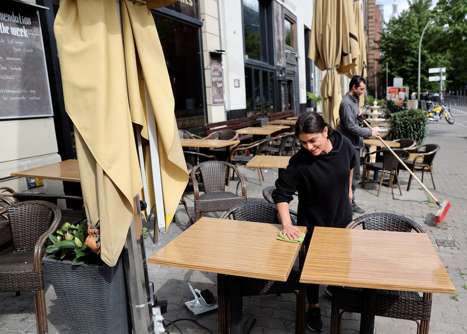 Staff of grand bar cafe restaurant prepare for reopening of the restaurant in berlin