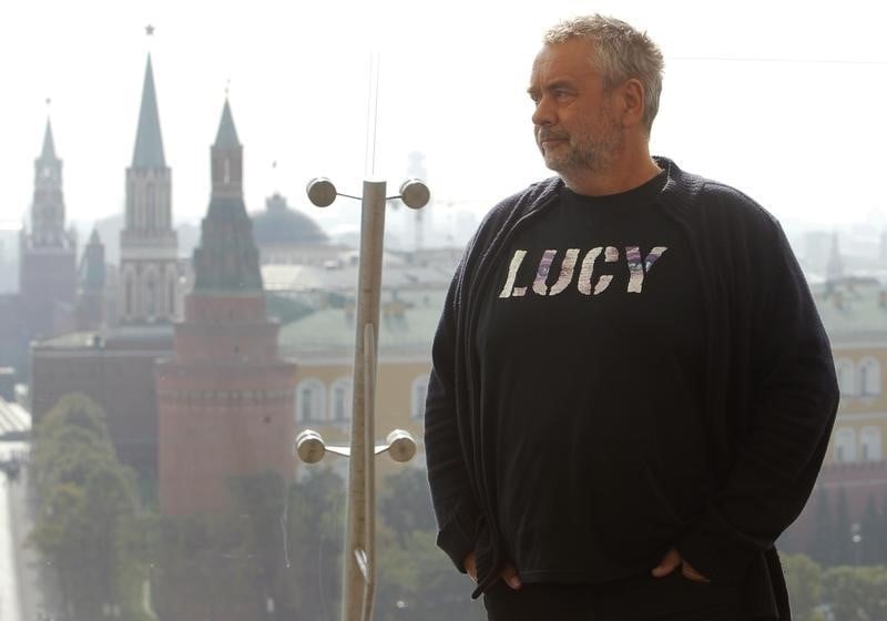 French film director luc besson poses during a photo call in front of moscow's kremlin