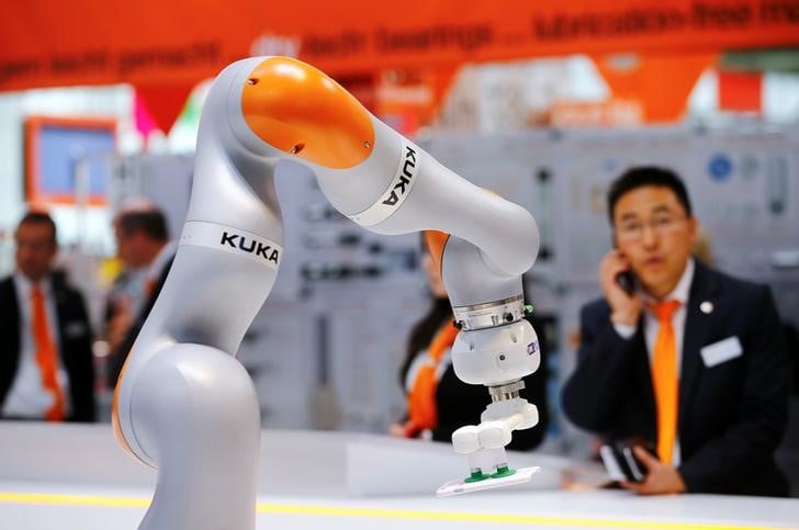 A robot arm of german industrial robot maker kuka is pictured at the company's stand in hanover