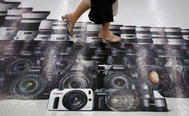 Canon soutenu par les équipements de bureau, la photo à la peine