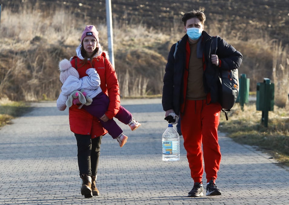 People cross the border between poland and ukraine