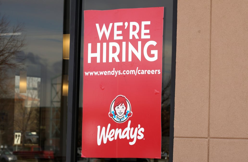 A sign seeking workers is seen at a wendy's store in westminster
