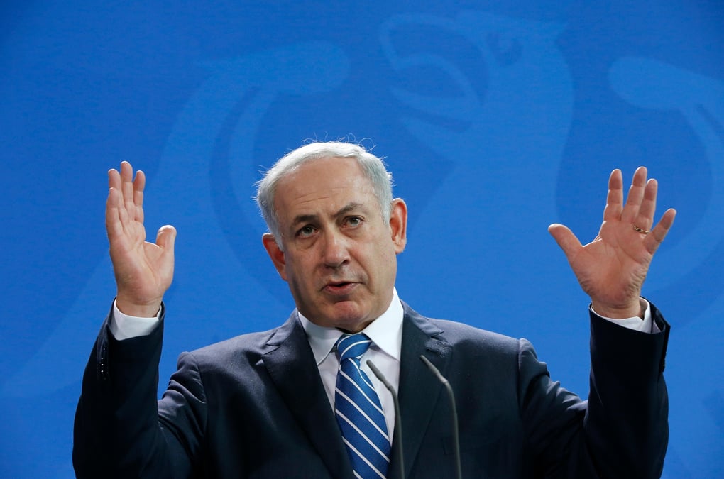 Israeli pm netanyahu gestures as he addresses a news conference at the chancellery in berlin