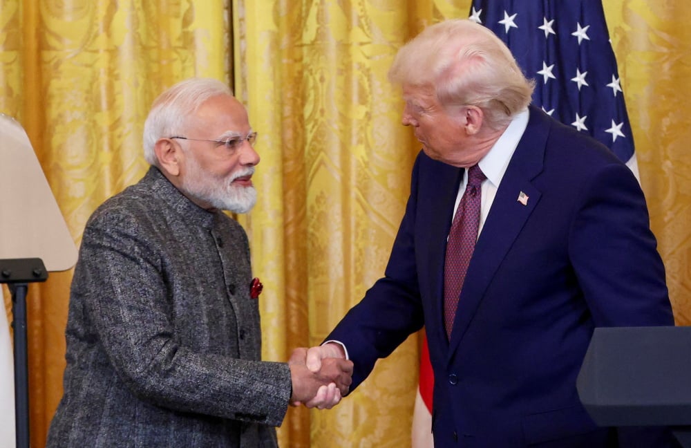 U.S. President Donald Trump and Indian Prime Minister Narendra Modi shake hands as they attend a joint press conference at the White House in Washington, D.C., U.S., February 13, 2025. REUTERS/Kevin Lamarque - U.S. President Trump holds a joint press...