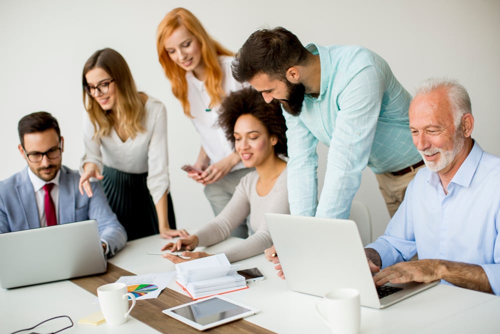 Multiracial business people working on project in office - Multiracial business people working in office