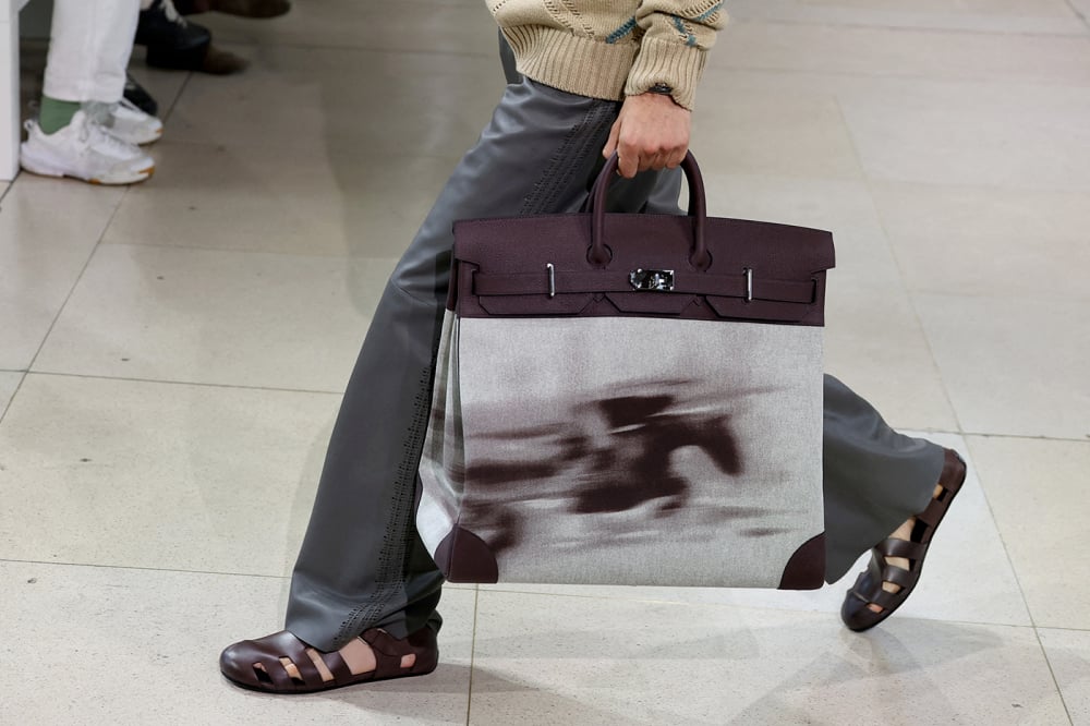FILE PHOTO: A model presents a creation by designer Veronique Nichanian as part of her Menswear Spring/Summer 2026 collection show for the fashion house Hermes during Men's Fashion Week in Paris, France, June 28, 2025. REUTERS/Gonzalo Fuentes/File...