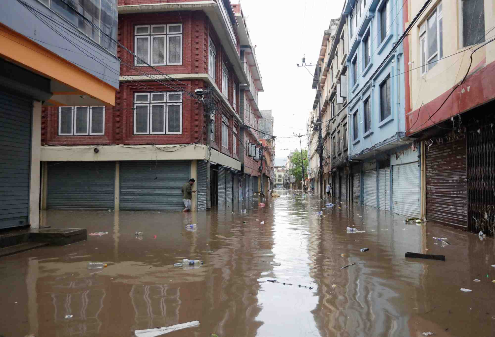 Flood along the bank of overflowing bagmati river following heavy rains in kathmandu