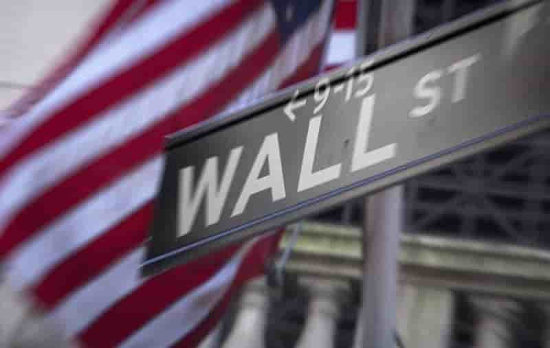 A wall street sign outside the new york stock exchange