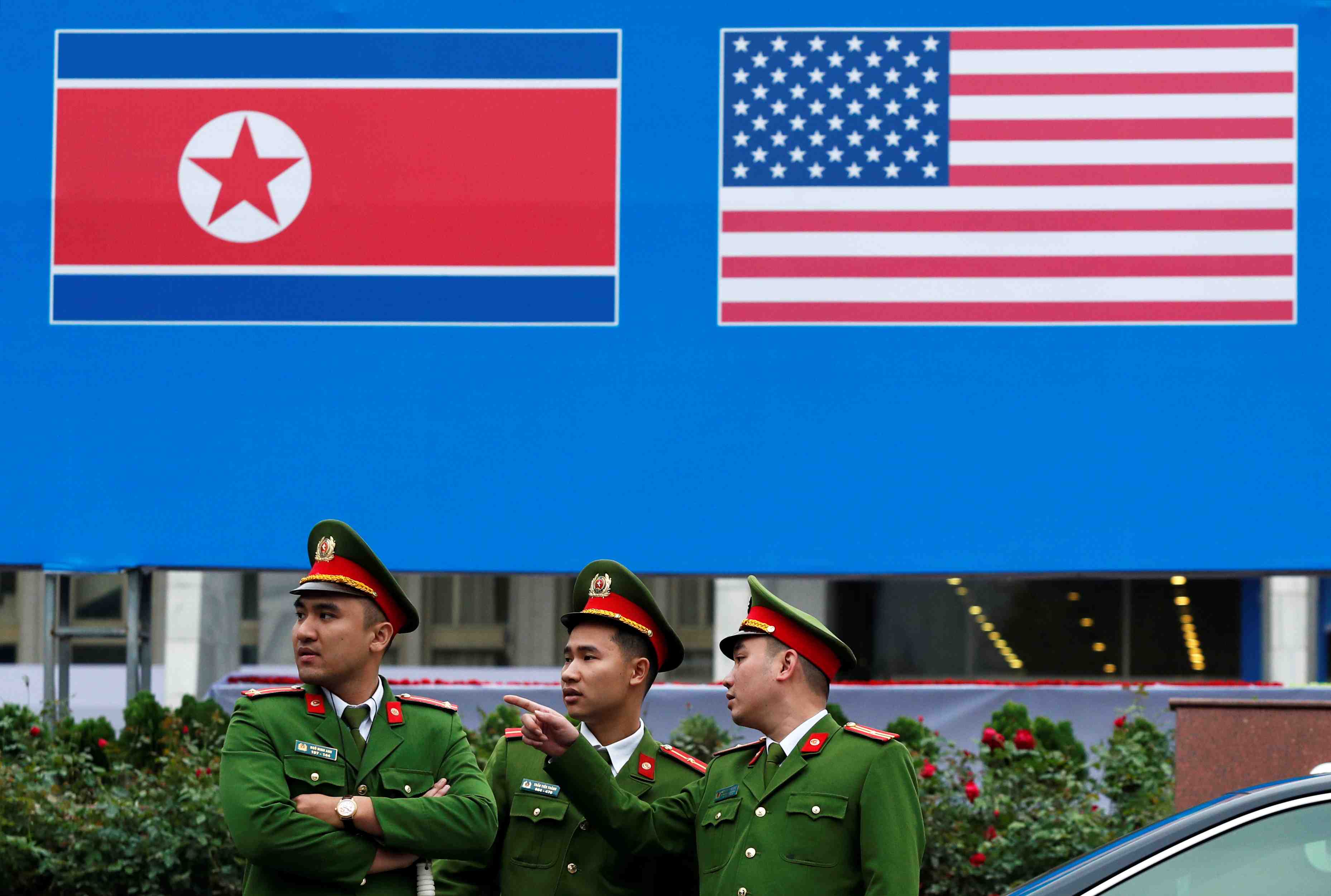 Vietnamese police officers stand guard outside the north korea-usa summit's media centre in hanoi