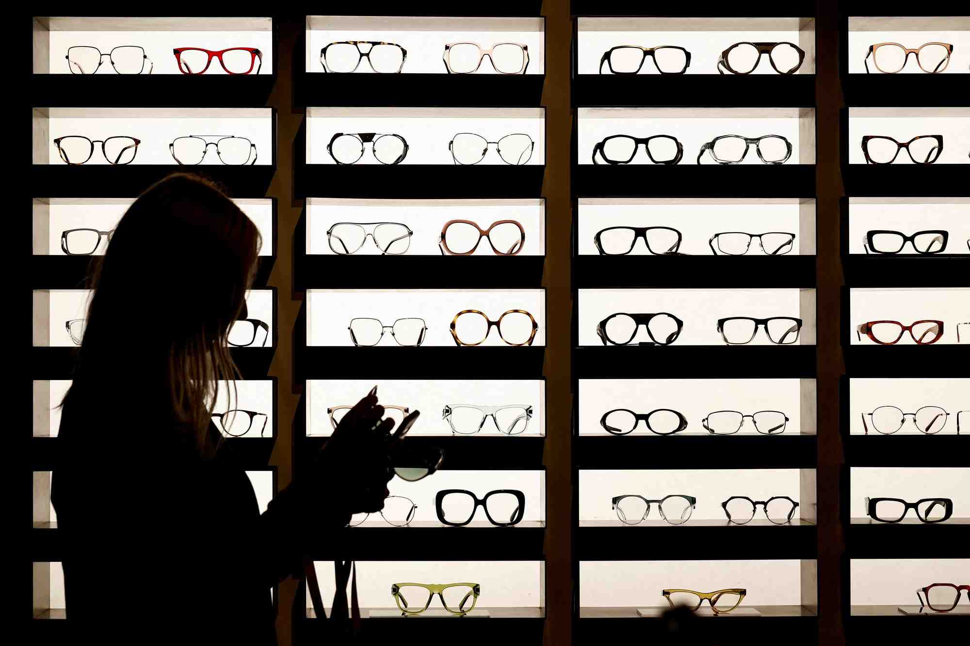 Des lunettes fabriquees par essilorluxottica sont presentees dans leur espace d'exposition au silmo a villepinte, pres de paris