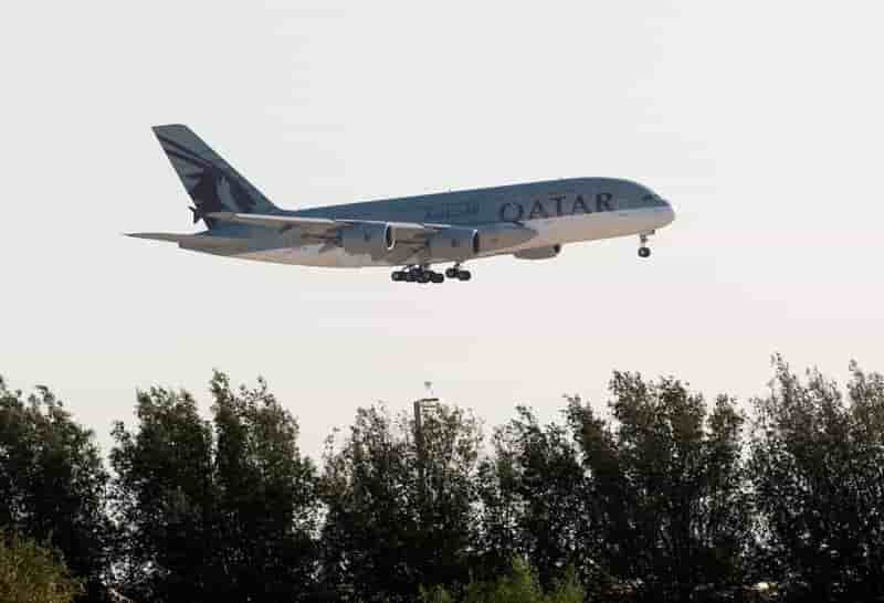 Qatar airways plane is seen over doha