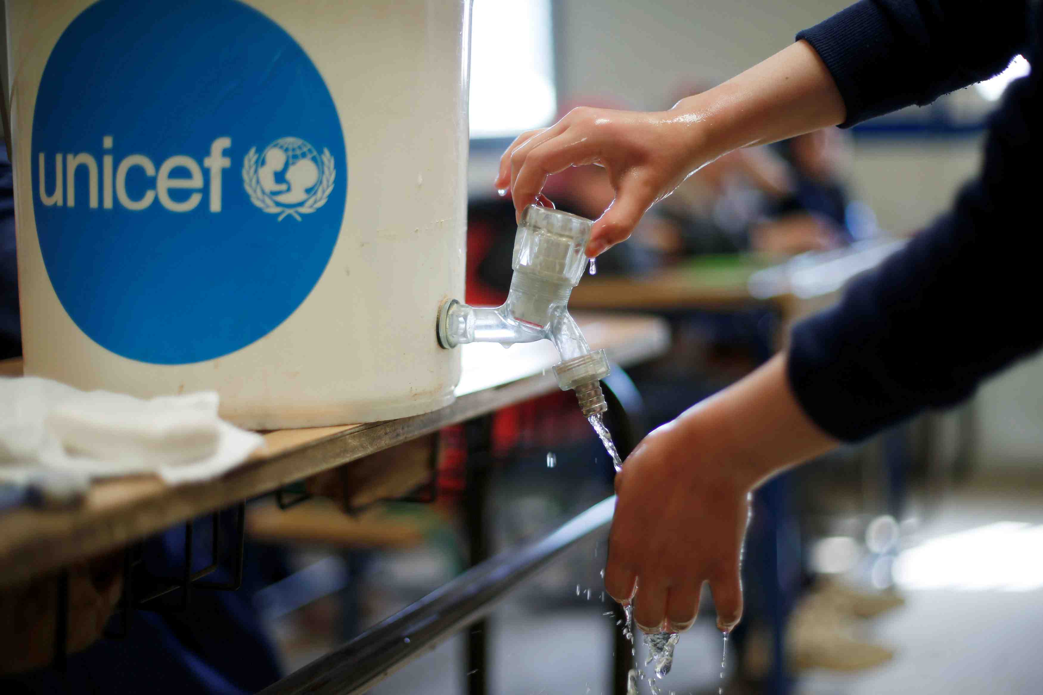 A syrian refugee student takes part in a washing hands activity as part of an awareness campaign about coronavirus initiated by oxfam and unicef at al zaatari refugee camp