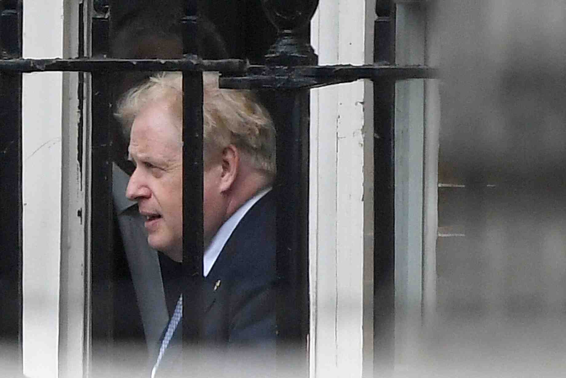 British pm johnson walks outside downing street in london