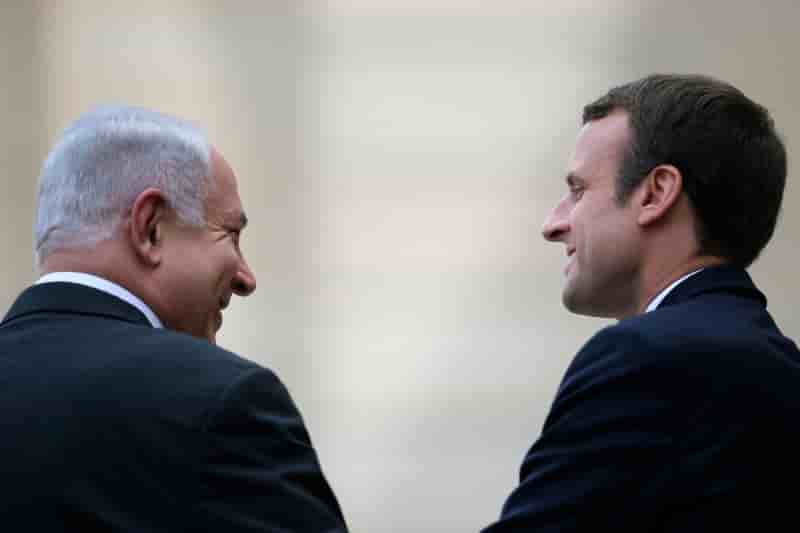 French president emmanuel macron escorts israeli prime minister benjamin netanyahu after their meeting at the elysee palace in paris