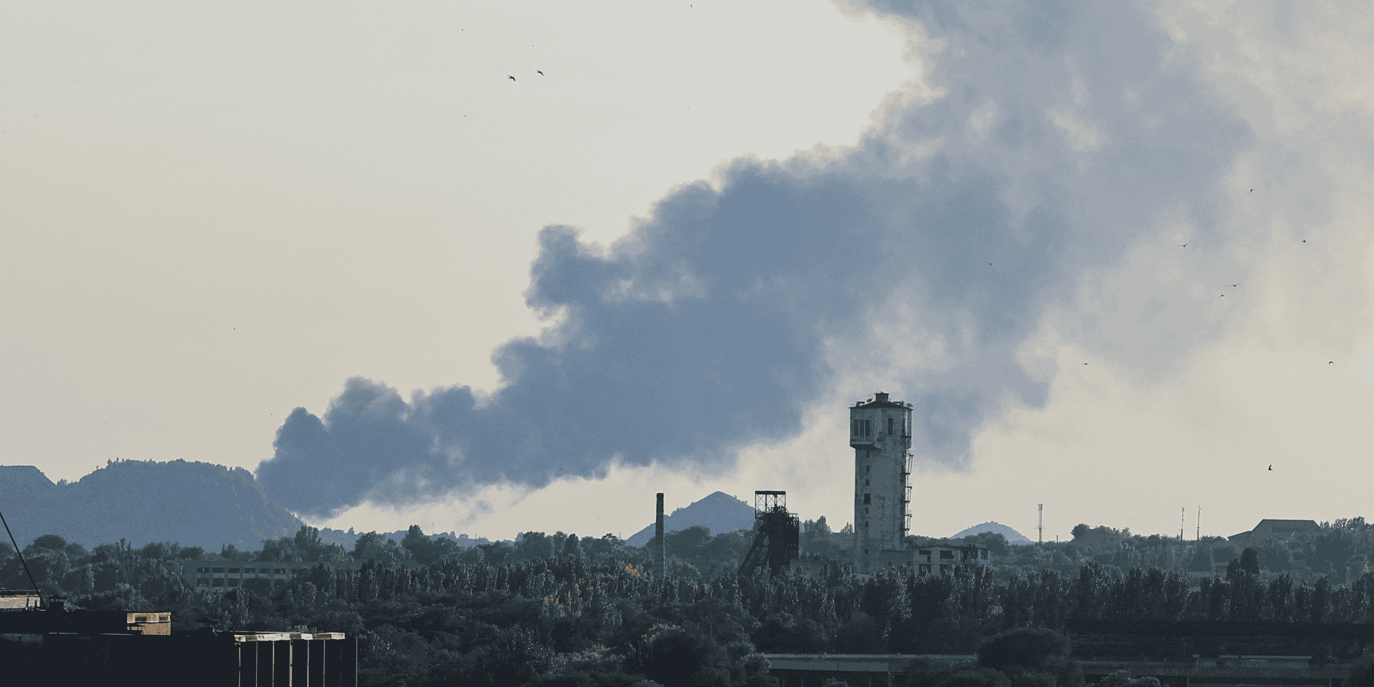 Smoke rises after shelling during ukraine-russia conflict in donetsk