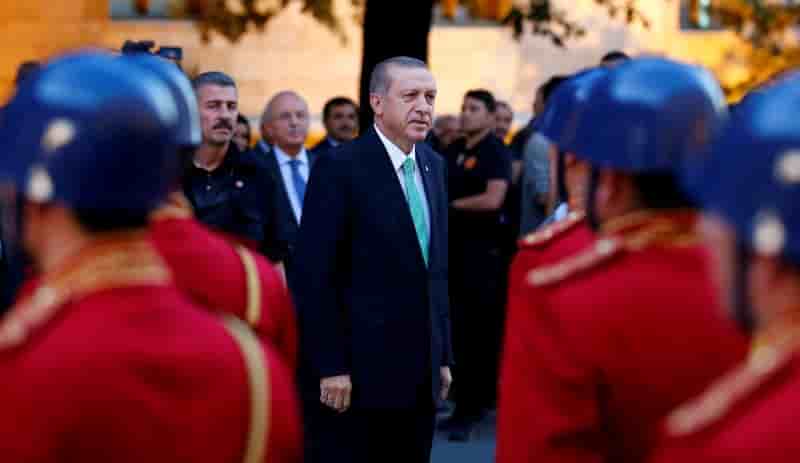 Turkish president tayyip erdogan reviews a guard of honour as he arrives to the turkish parliament in ankara