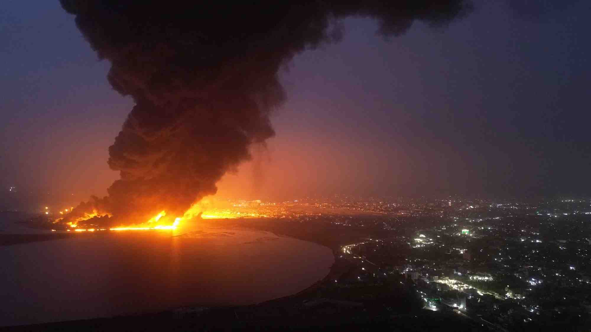 Smoke rises from a fire following an israeli air strike in hodeidah