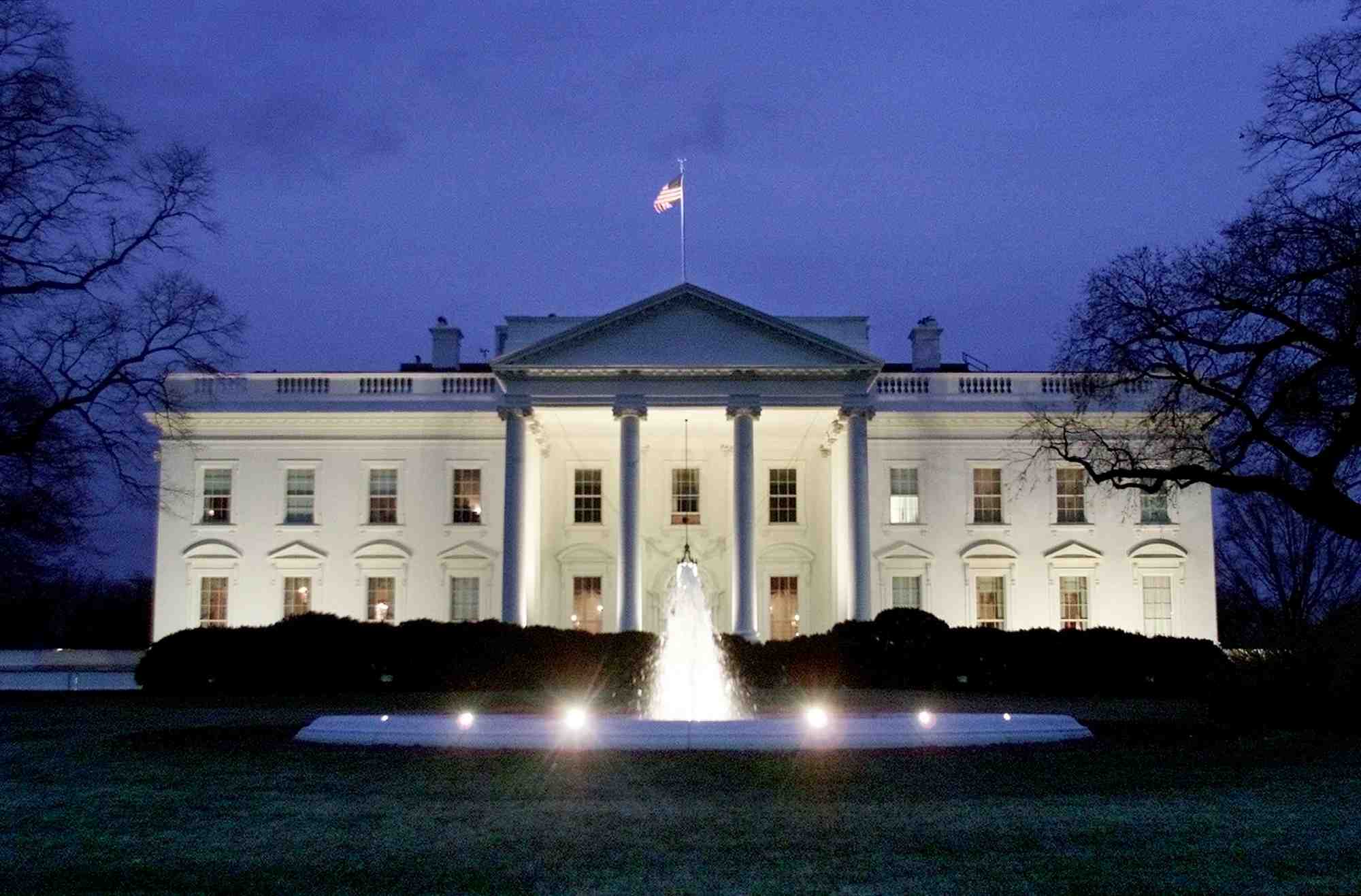 North portico of the white house as seen at night from pennsylvania avenue.