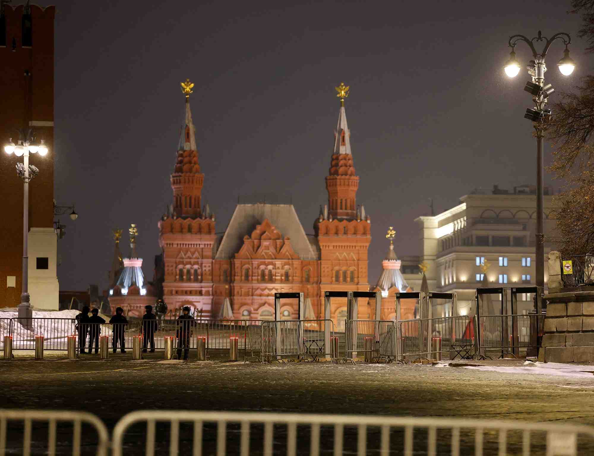 Law enforcement officers stand guard in red square during new year's eve celebrations in moscow