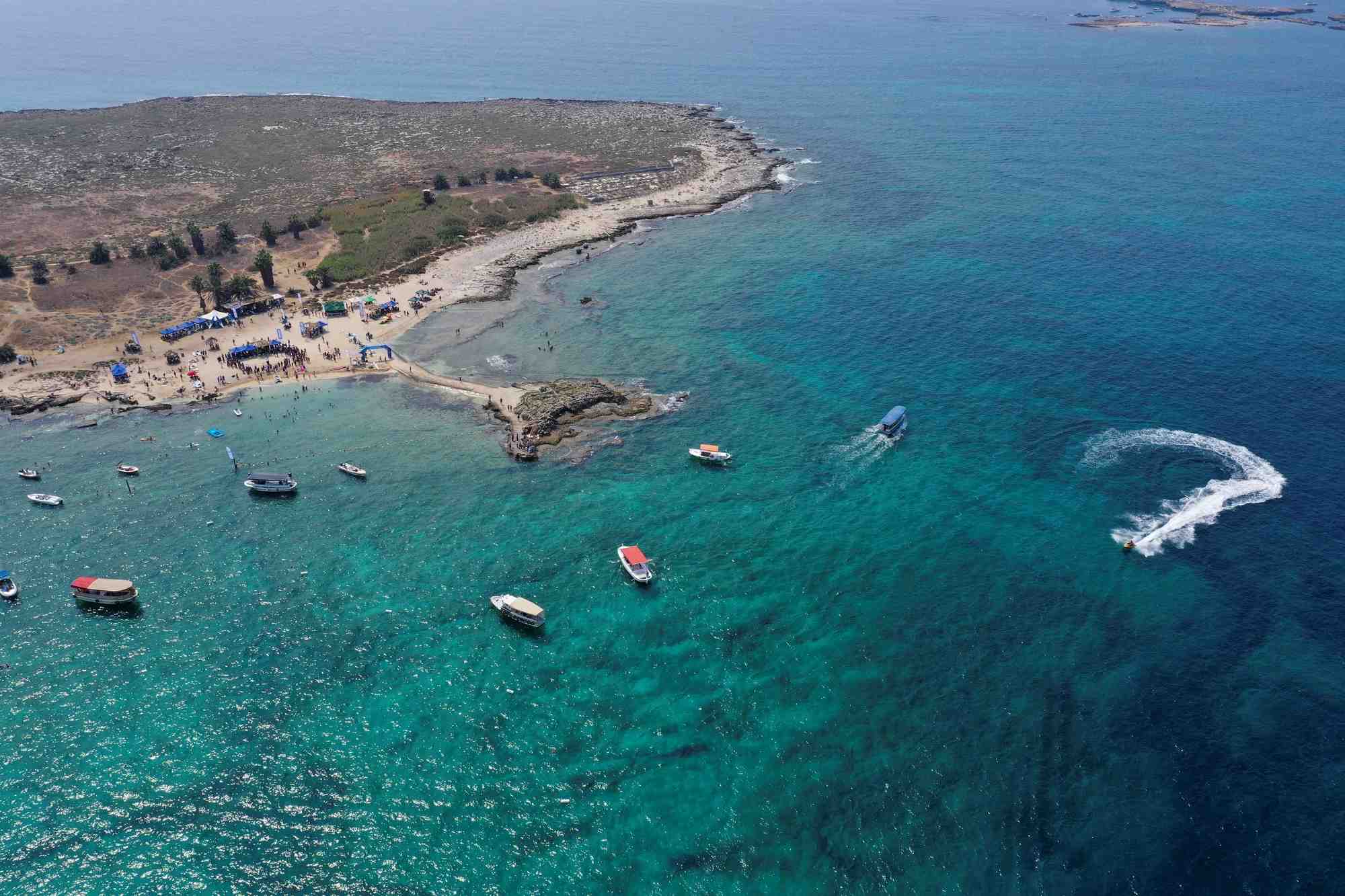 People enjoy the sea at the palm islands nature reserve in lebanon