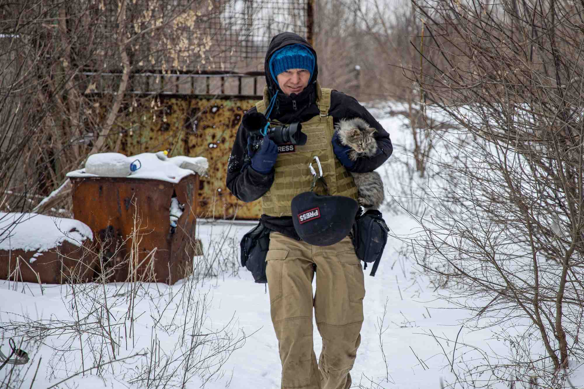 Ukrainian photographer maksim levin near the line of separation from russian-backed separatists in donetsk region