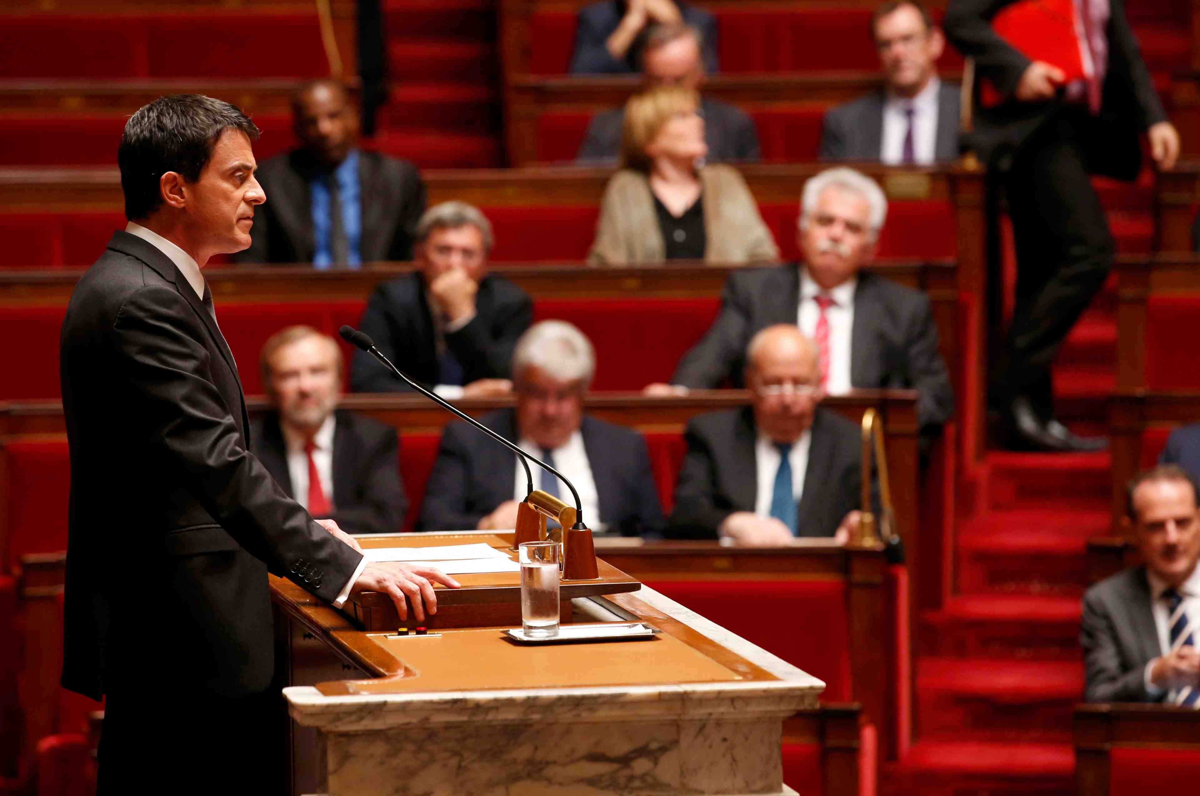 French prime minister manuel valls delivers a speech to use the article 49.3 and impose by decree a labour law reform bill, during its second hearing at the national assembly in paris