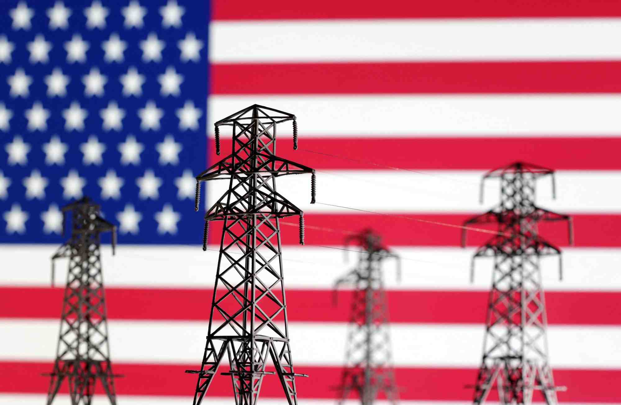 L'illustration montre des miniatures de transmission d'energie electrique et le drapeau americain